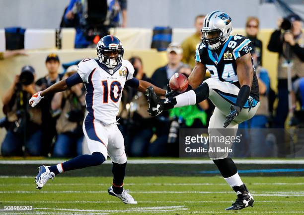 Kony Ealy of the Carolina Panthers intercepts a pass intended for Emmanuel Sanders of the Denver Broncos in the second quarter during Super Bowl 50...