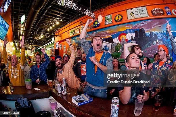 Denver Broncos fans watch Super Bowl 50 at Cheba Hut on February 7, 2016 in Denver, Colorado.