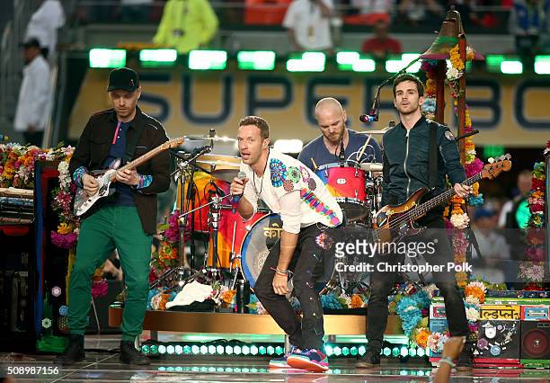 Jonny Buckland, Chris Martin, Will Champion and Guy Berryman of Coldplay perform onstage during the Pepsi Super Bowl 50 Halftime Show at Levi's...