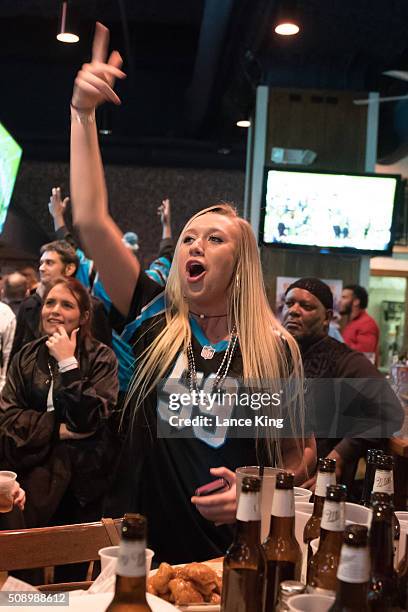 Fans of the Carolina Panthers cheer on their team against the Denver Broncos while watching Super Bowl 50 on February 7, 2016 at Wild Wing Cafe in...