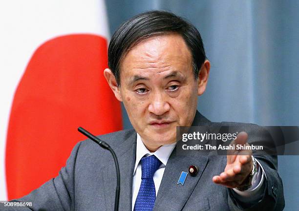 Japanese Chief Cabinet Secretary Yoshihide Suga speaks during the news conference held following North Korea's rocket launch at the Prime Minister's...