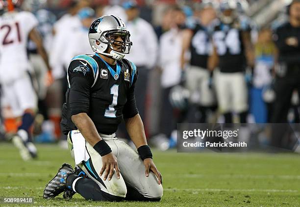 Cam Newton of the Carolina Panthers reacts on his knees after a play in the fourth quarter against the Denver Broncos during Super Bowl 50 at Levi's...