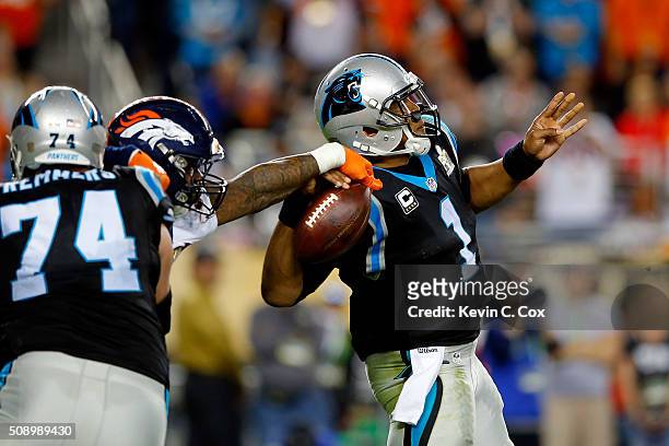 Von Miller of the Denver Broncos forces Cam Newton of the Carolina Panthers to fumble the ball during the fourth quarter of Super Bowl 50 at Levi's...