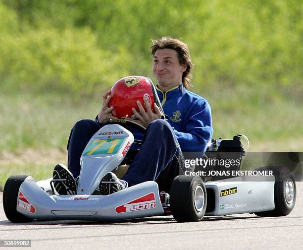 Soccer player Zlatan Ibrahimovic of Ajax removes the crash helmet after a go-cart race in Gimo, Sweden, 26 May 2004. The Swedish national soccer team...