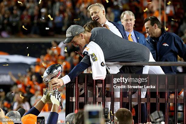 Peyton Manning of the Denver Broncos hands the Vince Lombardi Trophy to teammates after winning Super Bowl 50 at Levi's Stadium on February 7, 2016...