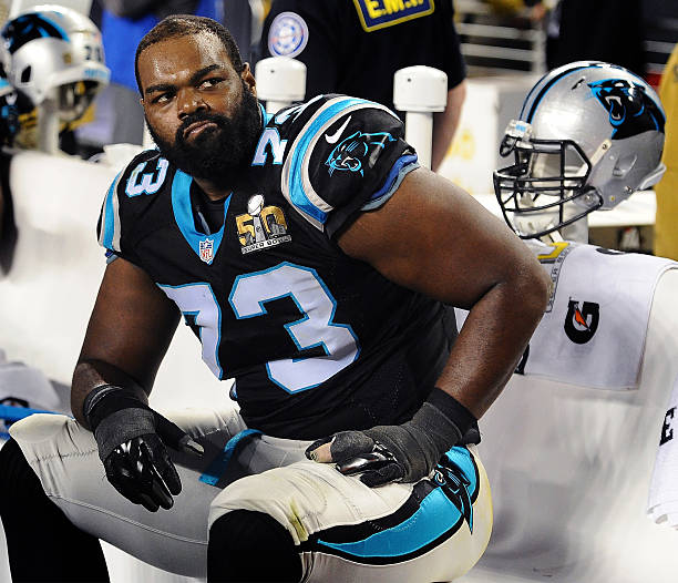 Carolina Panthers offensive tackle Michael Oher sits on the team's bench during the fourth quarter against the Denver Broncos in Super Bowl 50 at...