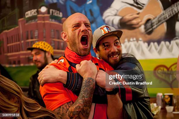 Denver Broncos fans watch Super Bowl 50 at Cheba Hut on February 7, 2016 in Denver, Colorado.