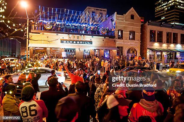 Denver Broncos fans celebrate in the street after the Denver Broncos won Super Bowl 50 on Market Street in Lower Downtown on February 7, 2016 in...