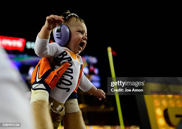 Owen Daniels of the Denver Broncos lifts his baby up at the end of the game. The Denver Broncos played the Carolina Panthers in Super Bowl 50 at...