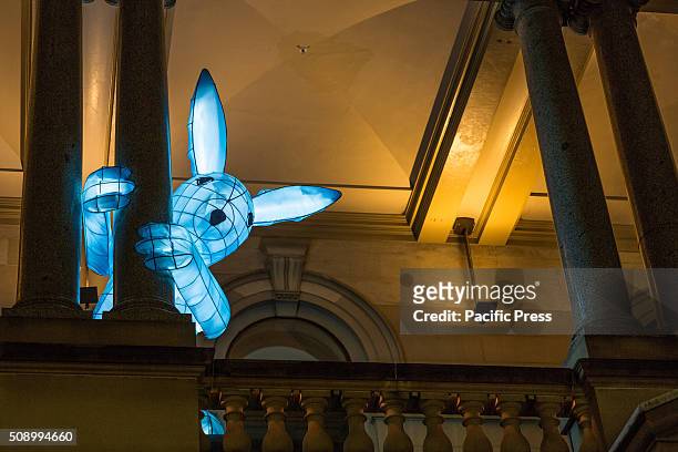 One of Claudia Chan Shaw's 14 Zodiac rabbits playfully peaks out from the balcony of Customs House. Major landmarks across Sydney were lit in red...