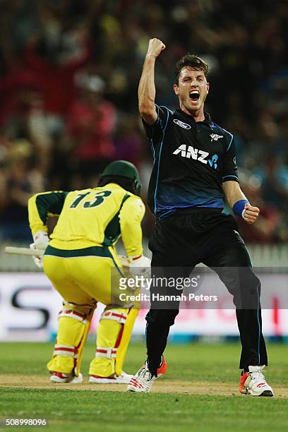 Adam Milne of the Black Caps celebrates the wicket of Matthew Wade of Australia during the 3rd One Day International cricket match between the New...