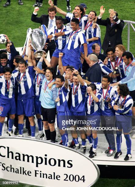 Germany: FC Porto players celebrate on the podium after beating Monaco 3-0 in the final of the Champions League football match, 26 May 2004 at the...