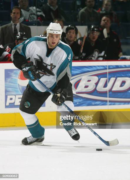 Defenseman Kyle McLaren of the San Jose Sharks looks to make a pass against the Buffalo Sabres during the game on February10, 2004 at HSBC Arena in...