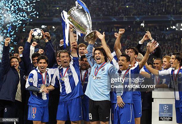 Germany: FC Porto players celebrate with the trophy after beating Monaco 3-0 in the final of the Champions league football match, 26 May 2004 at the...