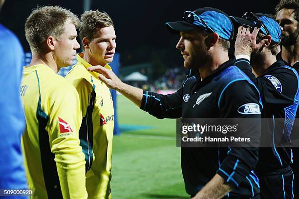 Steve Smith of Australia and David Warner of Australia speaks with Brendon McCullum of the Black Caps after losing the 3rd One Day International...