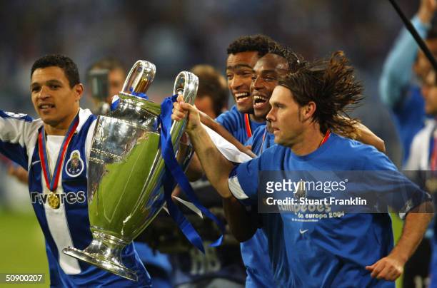 Derlei, Jose Bosingwa, Maniche and Richardo Costa of FC Porto celebrate winning the Champions League during the UEFA Champions League Final match...