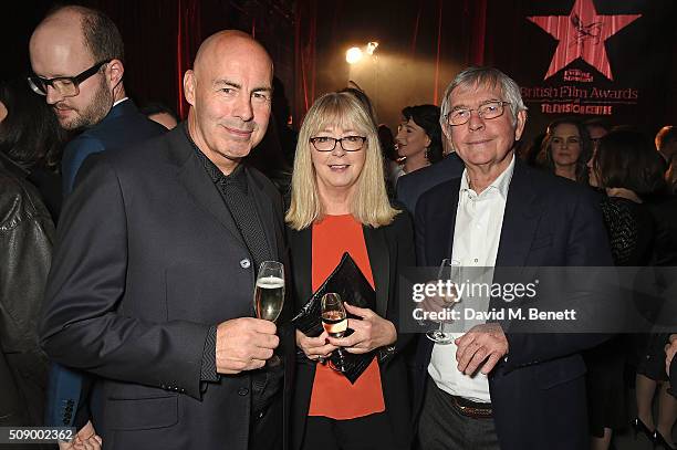 Guest, Isabel Crossley and Sir Tom Courtenay attend a champagne reception at the London Evening Standard British Film Awards at Television Centre on...