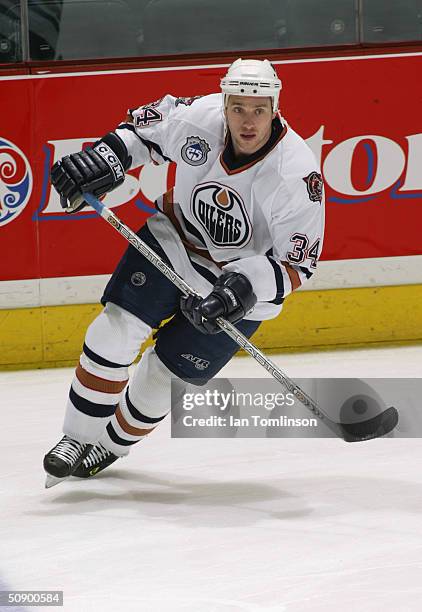 Fernando Pisani of the Edmonton Oilers skates during warm up prior to the game against the Calgary Flames at The Pengrowth Saddledome on December 23,...