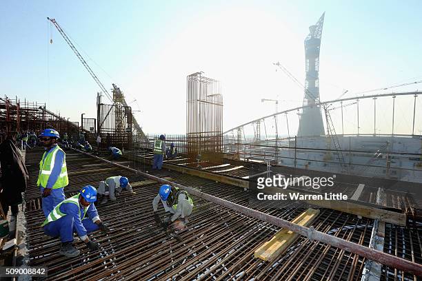 Construction workers on Khalifa International Stadium ahead of the 2022 FIFA World Cup Qatar on December 30, 2015 in Doha, Qatar.