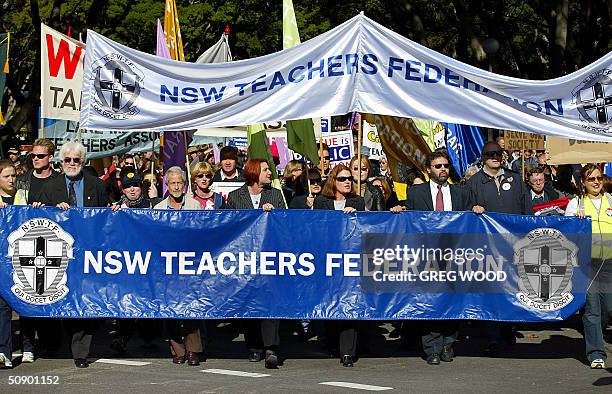 Thousands of striking teachers march on the New South Wales parliament, in Sydney 27 May 2004. 10,000 striking public school and TAFE teachers in...