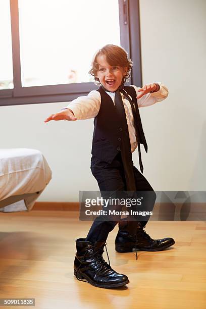 Boy in formal wear posing at home