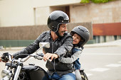 Father and son riding motorbike