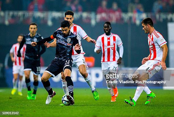 Stefanos Athanasiadis of PAOK is defended by Alberto Botia of Olympiacos during the Superleague Greece match between Olympiacos Piraeus and PAOK at...
