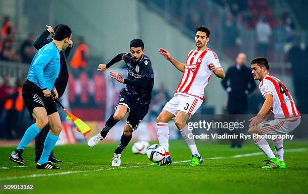 Stefanos Athanasiadis of PAOK is defended by Alberto Botia of Olympiacos during the Superleague Greece match between Olympiacos Piraeus and PAOK at...