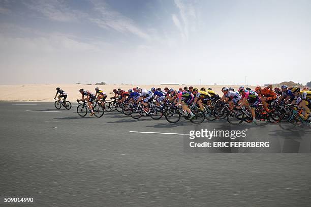 The pack rides during the first stage of the 2016 Tour of Qatar, between Dukhan and Al Khor Corniche on February 8, 2016. Britain's Mark Cavendish,...