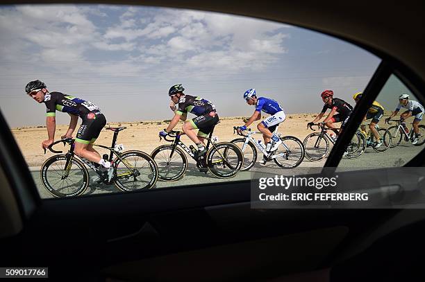 The pack rides during the first stage of the 2016 Tour of Qatar, between Dukhan and Al Khor Corniche on February 8, 2016. Britain's Mark Cavendish,...