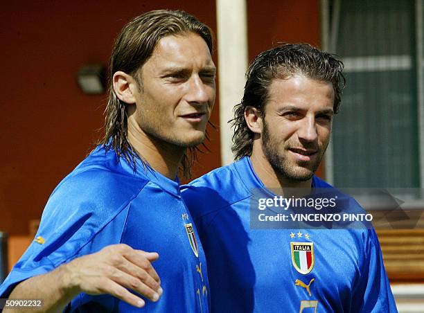 Italy player Francesco Totti poses together with Alessandro Del Piero during a photo session at Coverciano training camp near Florence 27 May 2004....