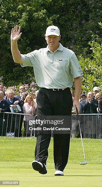 Ernie Els of South Africa acknowledges the crowd on the 18th green during the first round of the Volvo PGA Championship at the Wentworth Club on May...