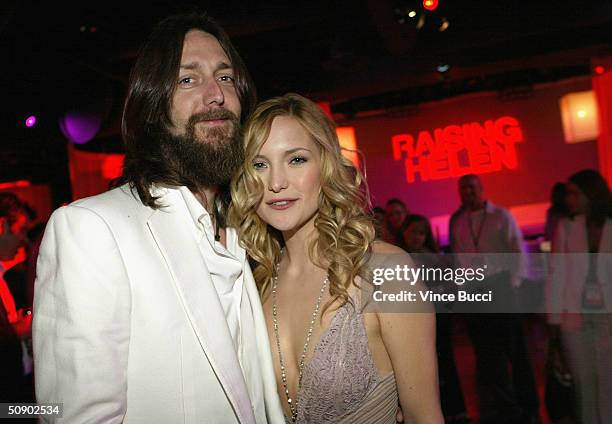 Actress Kate Hudson and husband, musician Chris Robinson, pose as they attend the film premiere after party for the romantic comedy "Raising Helen"...