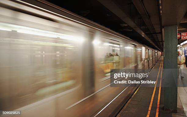 train races through the nyc subway, usa - underground station stock pictures, royalty-free photos & images