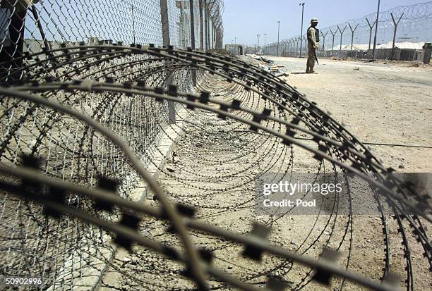 Soldier stands guard at Abu Ghraib prison May 26, 2004 in Baghdad, Iraq. The U.S. Military to moved detainees to the newly built Camp Redemption in...