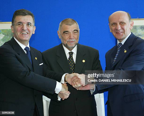 Serbia and Montenegro President Svetozar Marovic , Croatian President Stjepan Mesic and Bosnia and Herzegovina President Sulejman Tihic shake hands...