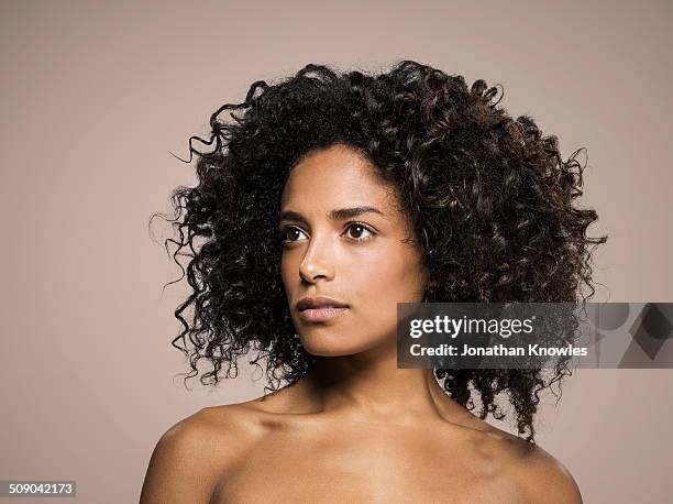 portrait of a dark skinned female, looking away - semi dress fotografías e imágenes de stock