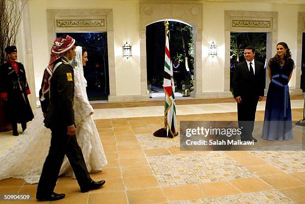 Crown Prince Hamzeh of Jordan and his bride Princess Noor attend their wedding celebrations as Jordan's King Abdullah II and his wife Queen Rania...