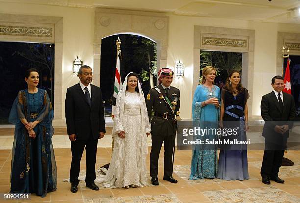 Jordan's King Abdullah II, his wife Queen Rania, Queen Noor, mother of the groom, Crown Prince Hamzeh, the groom, his bride Princess Noor, Sherif...