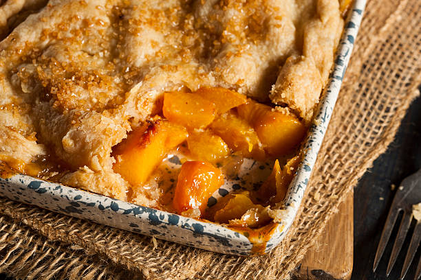 homemade flakey peach cobbler - peach cobbler stock pictures, royalty-free photos & images