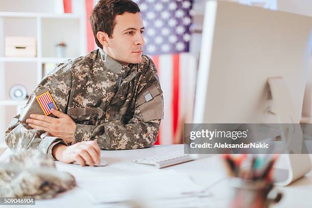 soldier in the office - military computer stock pictures, royalty-free photos & images