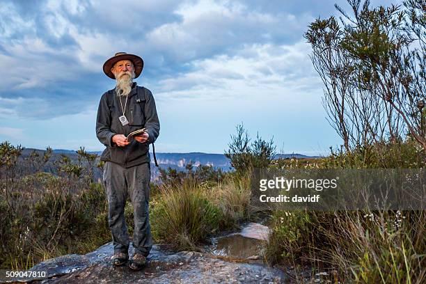 senior man bushwalking in spectacular blue mountains australian landscape - blue mountains stock pictures, royalty-free photos & images