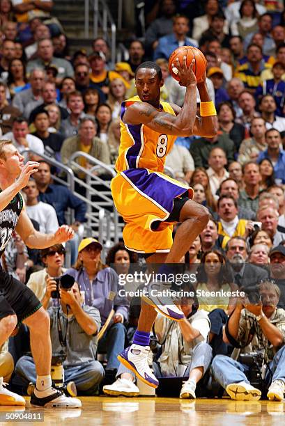 Kobe Bryant of the Los Angeles Lakers rebounds against the Minnesota Timberwolves defense in Game four of the Western Conference Finals during the...