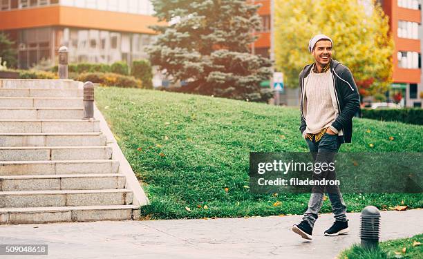 man walking in the city - man walking in a park stock pictures, royalty-free photos & images