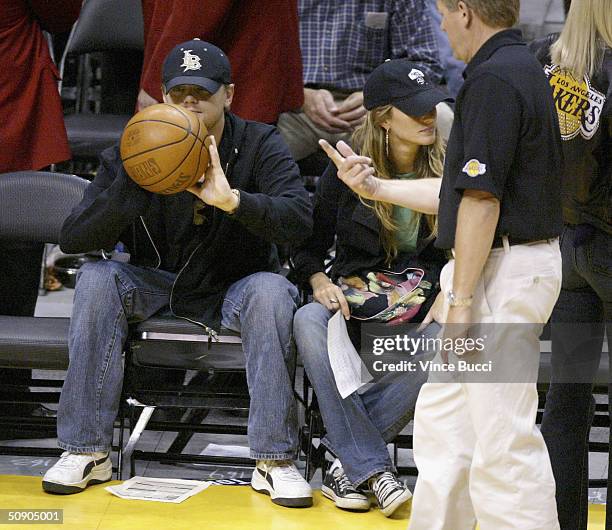 Actor Leonardo DiCaprio and girlfriend model Gisele Bundchen attend Game 4 of the NBA Western Conference Finals between the Minnesota Timberwolves...