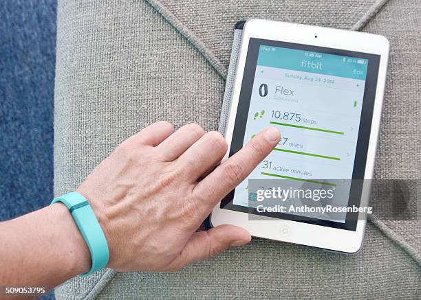 fitbit flex - fitbit stock pictures, royalty-free photos & images