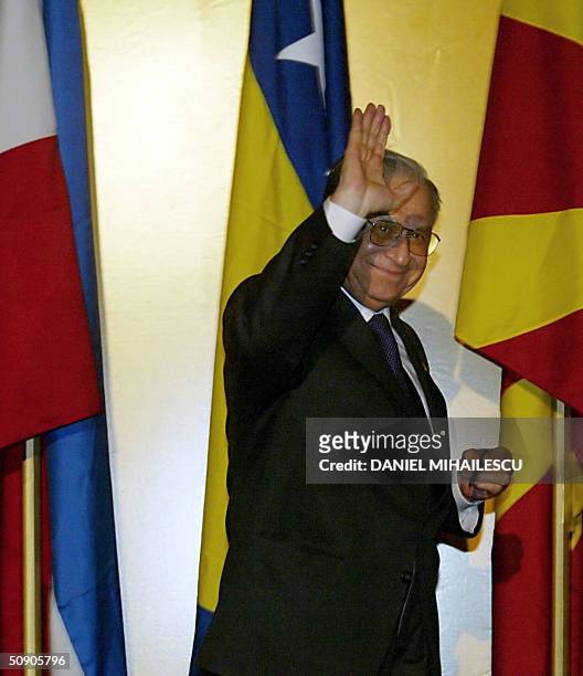Romanian President Ion Iliescu waves at the audience following the press conference of Romanian Summit 2004 in Mamaia, 28 May 2004. Sixteen Central...
