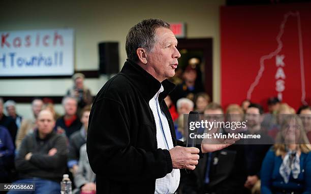 Republican presidential candidate, Ohio Gov. John Kasich answers questions during a town hall at the Plaistow Town Hall February 8, 2016 in Plaistow,...