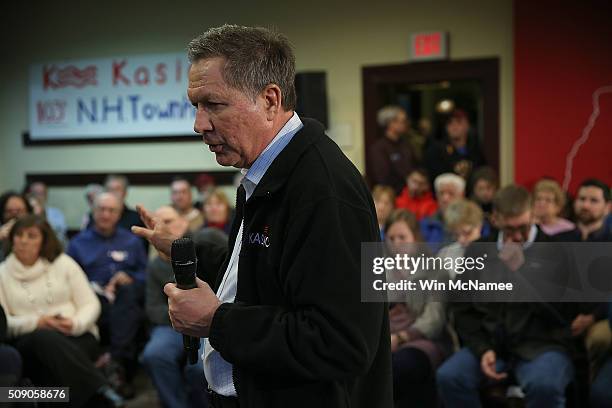 Republican presidential candidate, Ohio Gov. John Kasich answers questions during a town hall at the Plaistow Town Hall February 8, 2016 in Plaistow,...