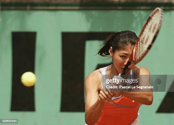 Shinobu Asagoe of Japan returns in her second round doubles match with Rika Fujiwara of Japan during Day Five of the 2004 French Open Tennis...